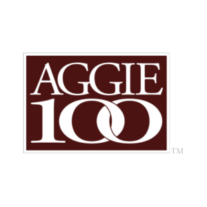 A logo featuring the word ‘AGGIE’ in large white letters on a maroon background, with the number ‘100’ in a stylized font and a trademark symbol, representing a significant milestone or achievement